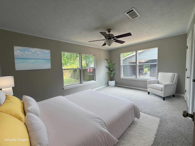 2370 Central Dr, Beaumont, TX 77706 - carpeted bedroom featuring crown molding, a ceiling fan, and baseboards