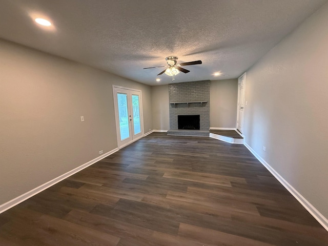 2370 Central Dr, Beaumont, TX 77706 - unfurnished living room featuring ceiling fan, dark wood finished floors, baseboards, a textured ceiling, and recessed lighting