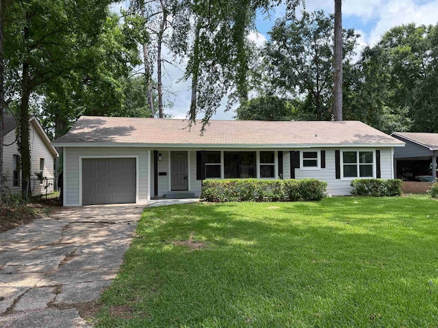 2370 Central Dr, Beaumont, TX 77706 - single story home featuring a garage, a front yard, and concrete driveway