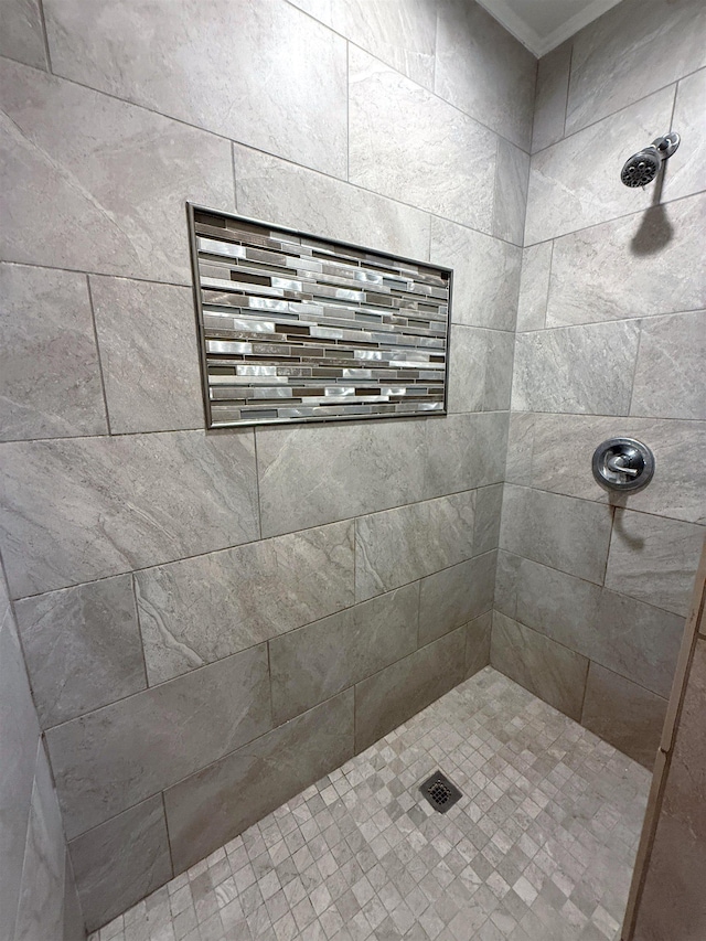 2370 Central Dr, Beaumont, TX 77706 - bathroom with tiled shower and ornamental molding