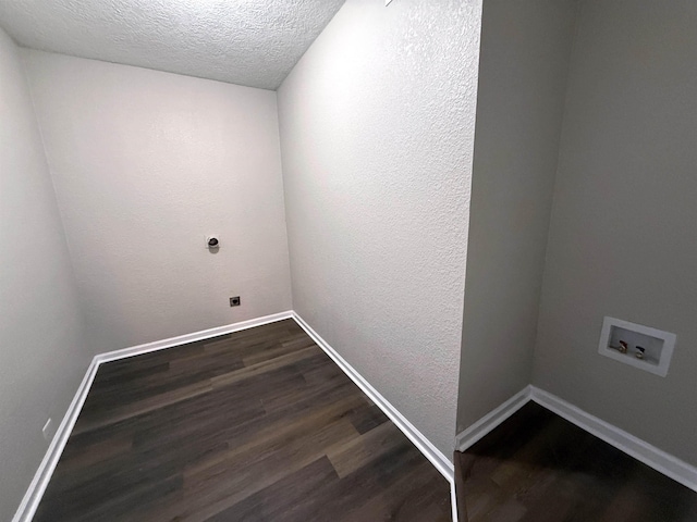 2370 Central Dr, Beaumont, TX 77706 - washroom featuring washer hookup, dark wood-style flooring, a textured ceiling, hookup for an electric dryer, and baseboards