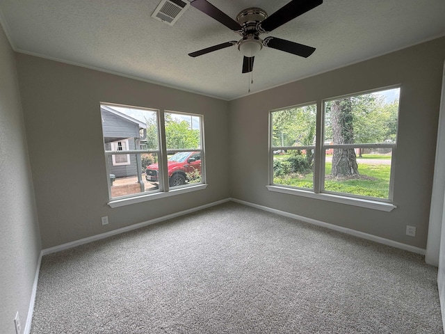 2370 Central Dr, Beaumont, TX 77706 - empty room with baseboards, a ceiling fan, carpet flooring, a textured ceiling, and crown molding