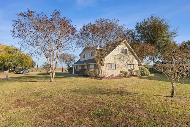 view of home's exterior featuring a yard