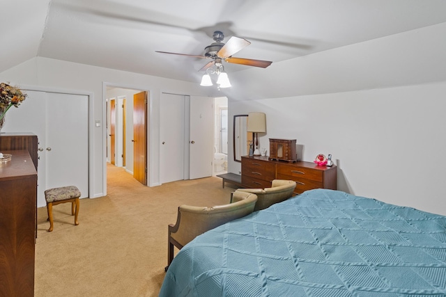 carpeted bedroom featuring ceiling fan and vaulted ceiling