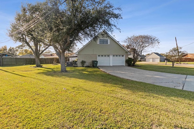 view of side of property featuring a yard and a garage