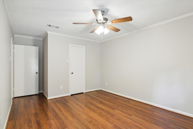 unfurnished room featuring dark hardwood / wood-style floors and crown molding