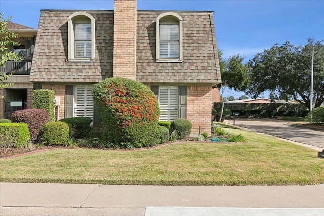 exterior space featuring a front lawn