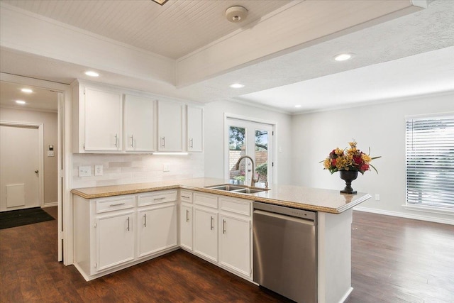 kitchen with backsplash, white cabinetry, dishwasher, and plenty of natural light