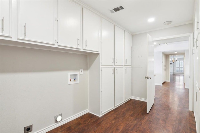 clothes washing area with electric dryer hookup, cabinets, an inviting chandelier, washer hookup, and dark hardwood / wood-style flooring