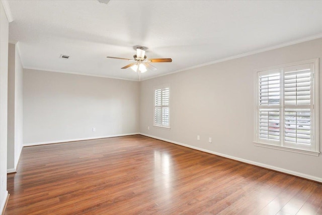 unfurnished room with hardwood / wood-style flooring, ceiling fan, and crown molding