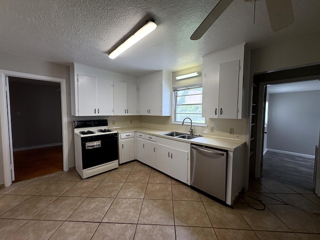 5115 Allen Dr, Beaumont, TX 77708 - kitchen with gas stove, stainless steel dishwasher, light tile patterned floors, light countertops, and white cabinetry
