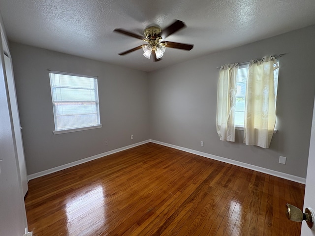 5115 Allen Dr, Beaumont, TX 77708 - unfurnished room with wood finished floors, ceiling fan, and a textured ceiling