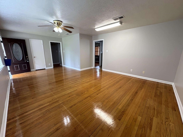 5115 Allen Dr, Beaumont, TX 77708 - spare room with a ceiling fan, hardwood / wood-style floors, and a textured ceiling