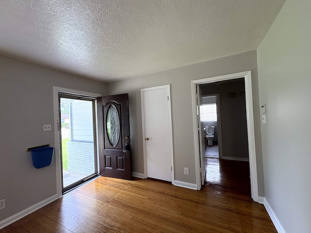 5115 Allen Dr, Beaumont, TX 77708 - entrance foyer featuring wood finished floors and a textured ceiling