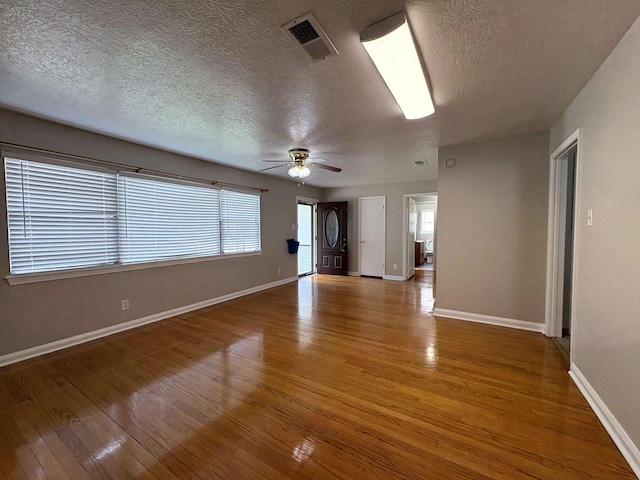 5115 Allen Dr, Beaumont, TX 77708 - spare room with a textured ceiling, light wood-style floors, and ceiling fan