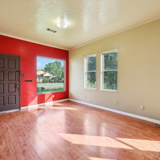 1710 17th St, Port Arthur, TX 77640 - interior space with visible vents, baseboards, crown molding, and hardwood / wood-style floors