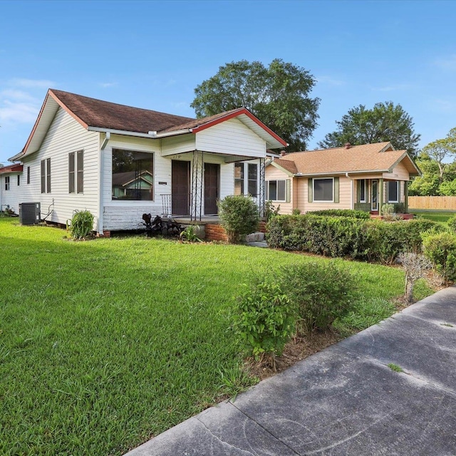 1710 17th St, Port Arthur, TX 77640 - view of front of house with a front lawn and central air condition unit