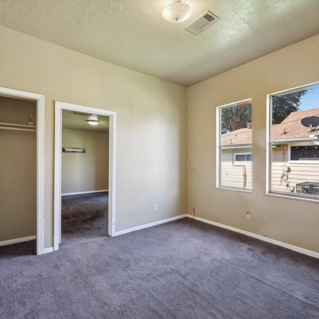 1710 17th St, Port Arthur, TX 77640 - unfurnished bedroom with baseboards, carpet, and visible vents