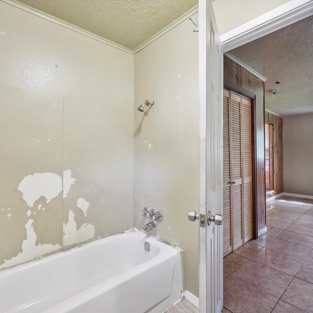 1710 17th St, Port Arthur, TX 77640 - bathroom with ornamental molding, a textured ceiling, and tub / shower combination