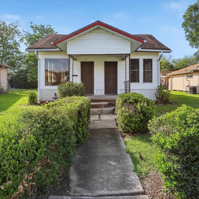 1710 17th St, Port Arthur, TX 77640 - bungalow featuring roof with shingles and cooling unit