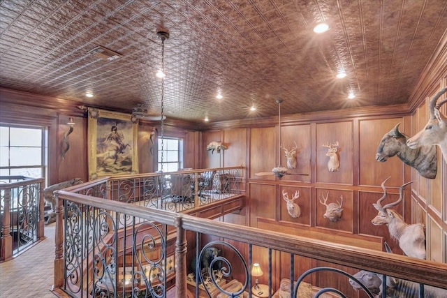 hall with wooden walls and brick ceiling