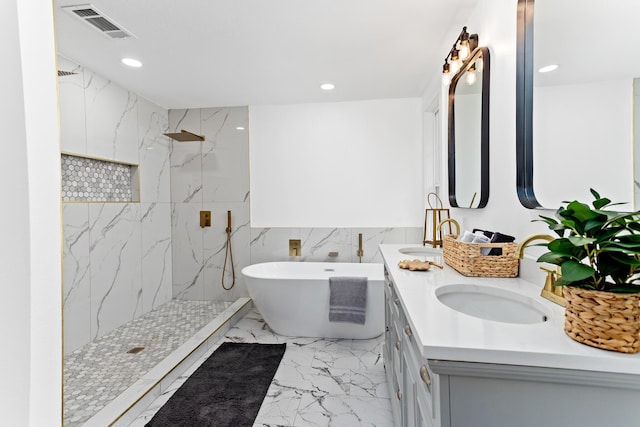 bathroom with vanity and independent shower and bath