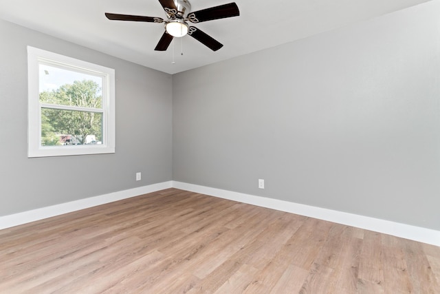 unfurnished room featuring light wood-type flooring and ceiling fan