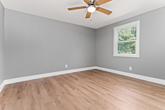 unfurnished room featuring ceiling fan and light wood-type flooring