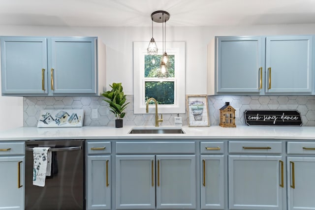 kitchen with pendant lighting, dishwasher, decorative backsplash, and sink