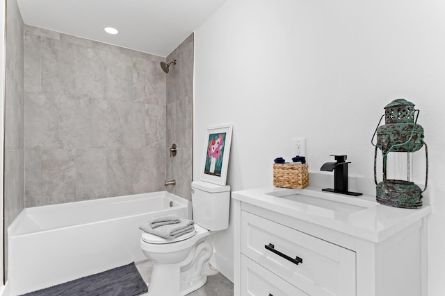 full bathroom featuring tile patterned floors, vanity, toilet, and tiled shower / bath combo