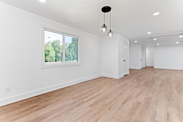 unfurnished room with light hardwood / wood-style flooring