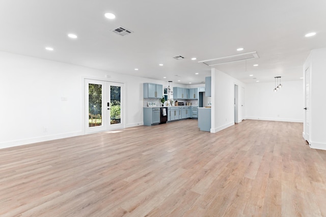 unfurnished living room with light hardwood / wood-style floors