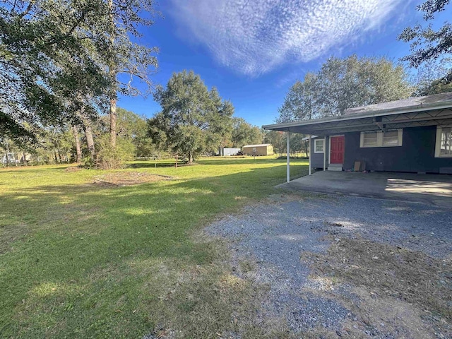 view of yard with a carport