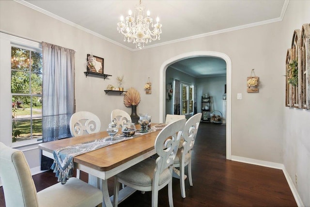 dining area with dark hardwood / wood-style floors, crown molding, a healthy amount of sunlight, and a notable chandelier