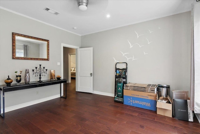 interior space with dark hardwood / wood-style flooring and crown molding