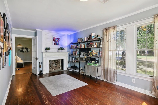 sitting room with ornamental molding, french doors, and dark wood-type flooring