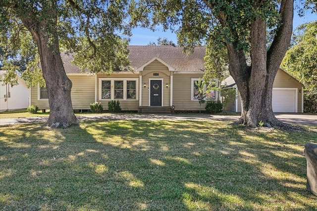 ranch-style house with a garage and a front lawn