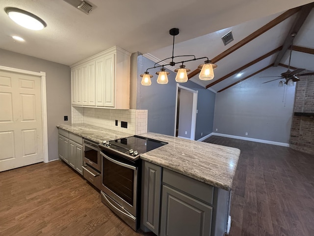 kitchen featuring lofted ceiling with beams, ceiling fan, stainless steel electric range oven, white cabinetry, and tasteful backsplash