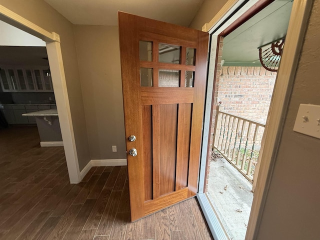 entryway with dark wood-type flooring