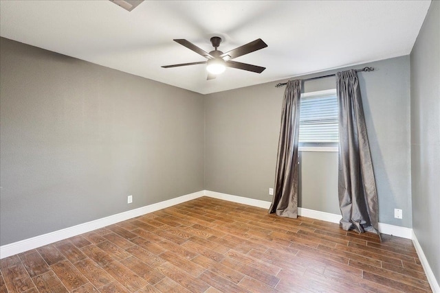 unfurnished room featuring hardwood / wood-style flooring and ceiling fan