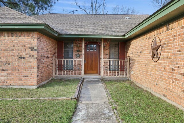 ranch-style house with a front yard and a garage