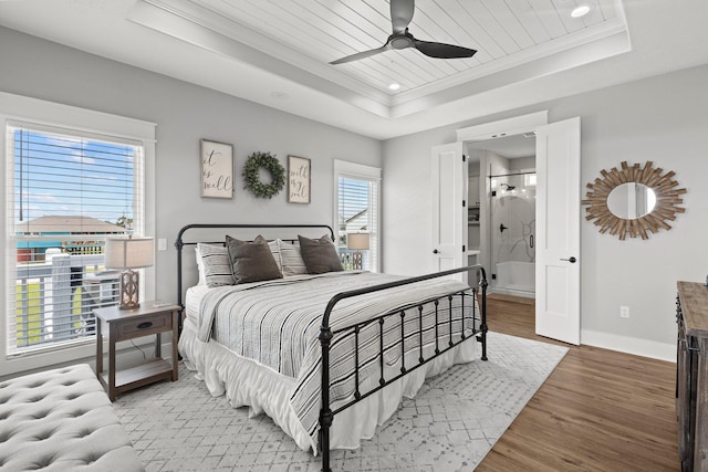 109 Ocean View Dr, Crystal Beach, TX 77650 - bedroom featuring light wood finished floors, recessed lighting, a raised ceiling, crown molding, and baseboards