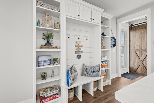109 Ocean View Dr, Crystal Beach, TX 77650 - mudroom featuring a barn door and wood finished floors