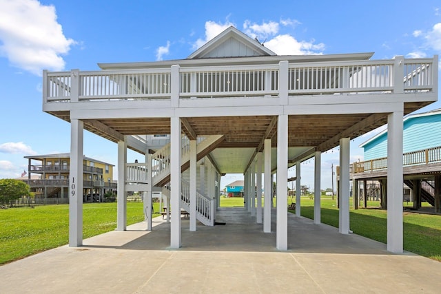 109 Ocean View Dr, Crystal Beach, TX 77650 - view of patio with driveway, stairway, and a wooden deck
