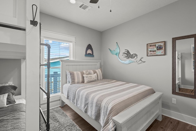 109 Ocean View Dr, Crystal Beach, TX 77650 - bedroom with dark wood-style flooring, visible vents, ceiling fan, and baseboards