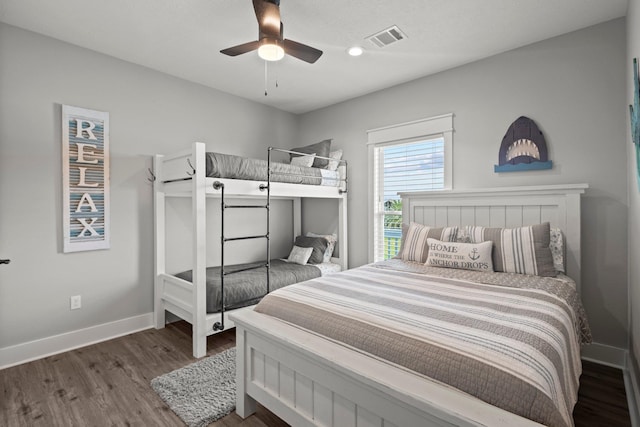 109 Ocean View Dr, Crystal Beach, TX 77650 - bedroom featuring wood finished floors, visible vents, ceiling fan, and baseboards
