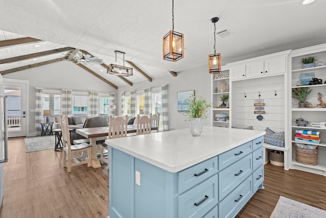 109 Ocean View Dr, Crystal Beach, TX 77650 - kitchen with white cabinets, wood finished floors, open shelves, and light countertops