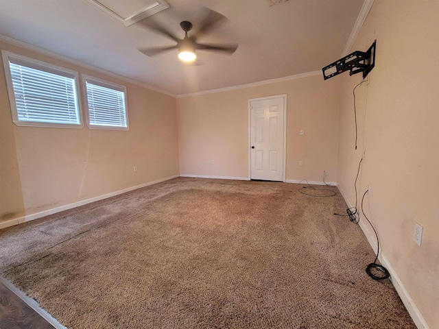 carpeted empty room featuring ceiling fan and ornamental molding