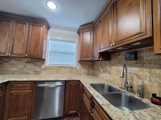 kitchen featuring light stone countertops, dishwasher, sink, backsplash, and ornamental molding