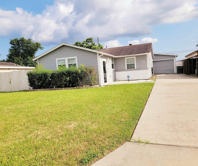 single story home featuring a front yard and a garage